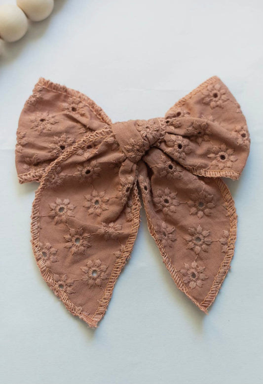 Brown embroidered bow